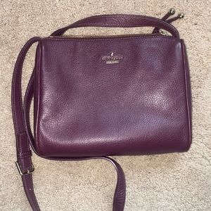 medium sized, plum colored kate spade purse